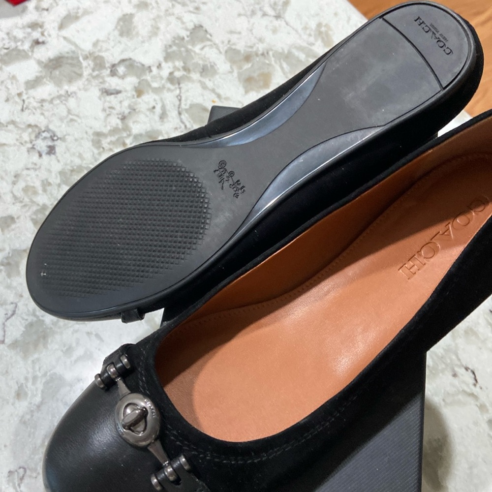 New only worn once coach black leather shoes in box.